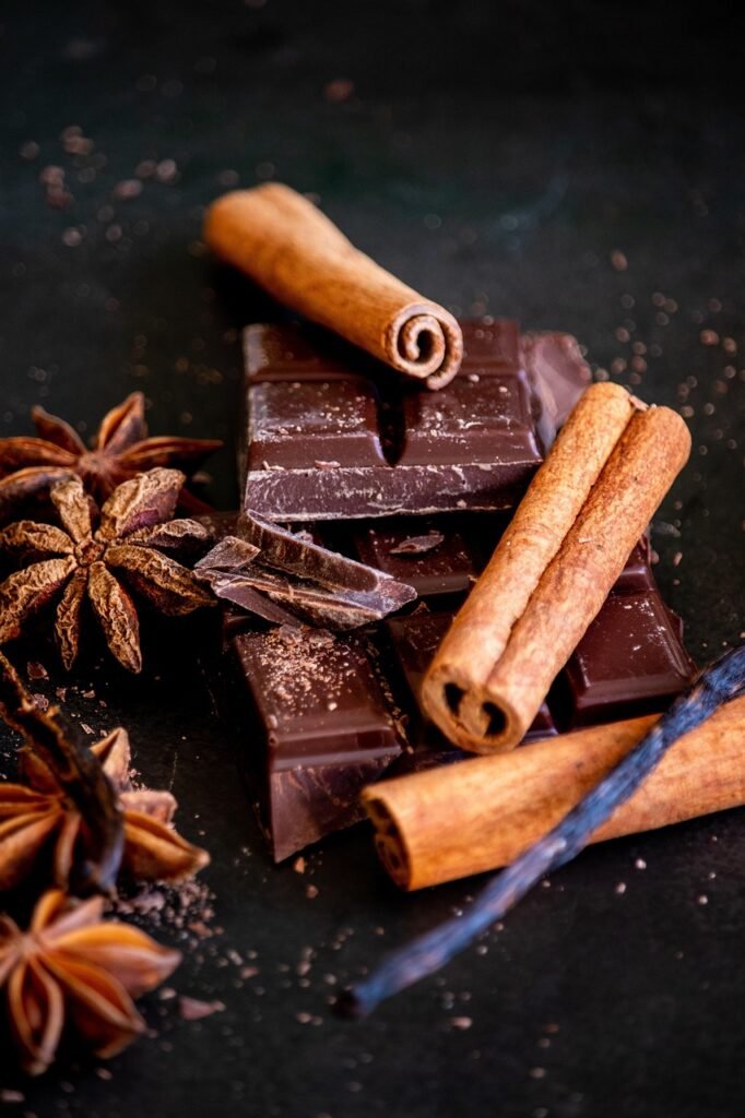 A Bolivian Cacao Story cinnamon sticks, chocolate, star anise, chocolate bars, spices, ingredients, cacao, cocoa, food, food photography, composition, chocolate, chocolate, chocolate, chocolate, chocolate, cacao
